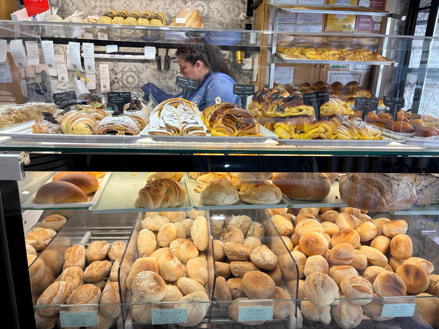 Portuguese breads and pastries displayed at a Porto bakery